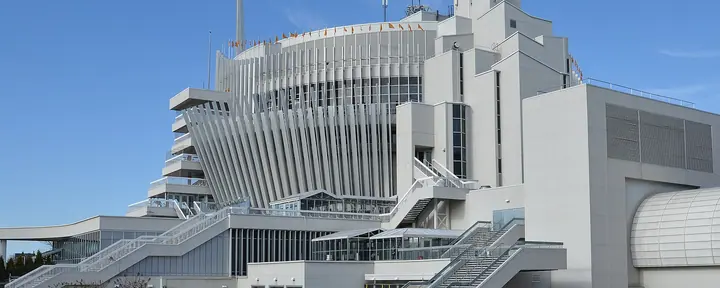 Casino de Montréal on Île Notre-Dame: the ribbed former French pavilion of Expo 67 with its outdoor stairways, under a clear sky